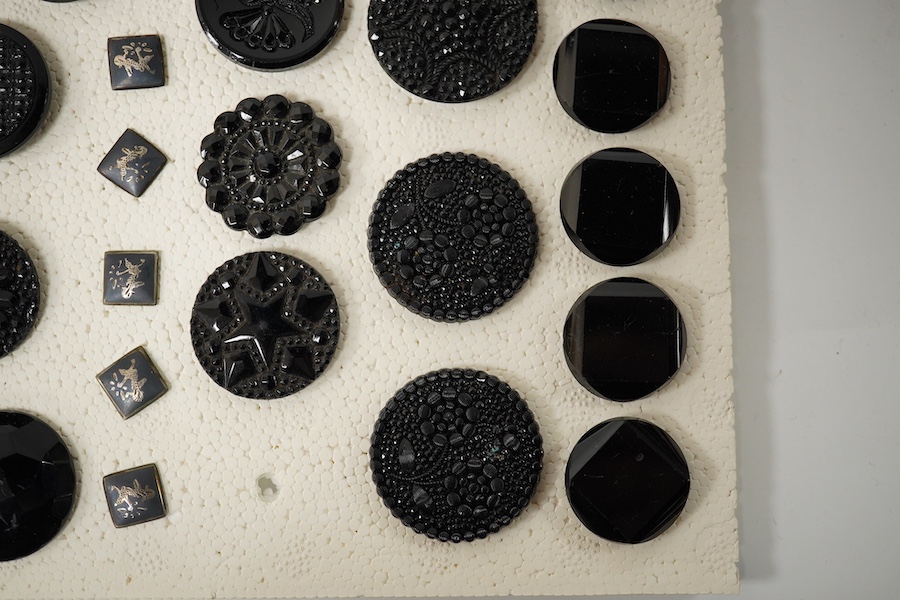 A collection of assorted Victorian and later jet, simulated jet and other decorative buttons, largest 50mm. Condition - good